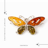 Brosa din chihlimbar forma de fluture multicolor si argint 925 - un accent cald de rafinament